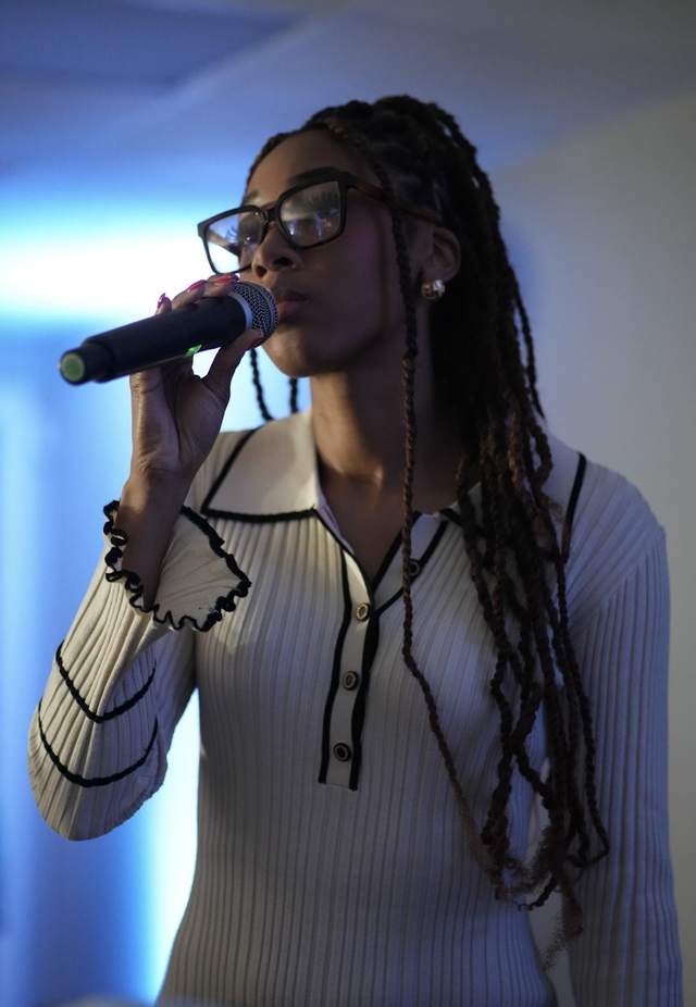 Jada speaking with a microphone