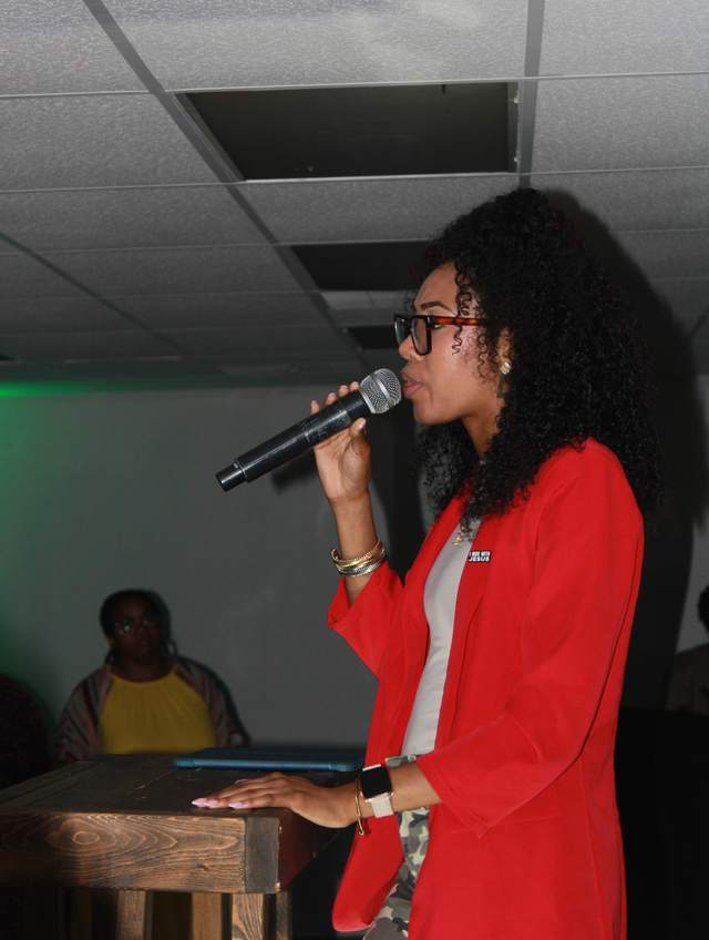 Jada Broughton speaking at a podium